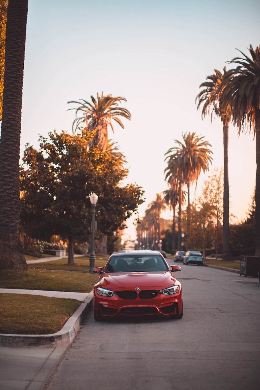 red car parked on the side of the road