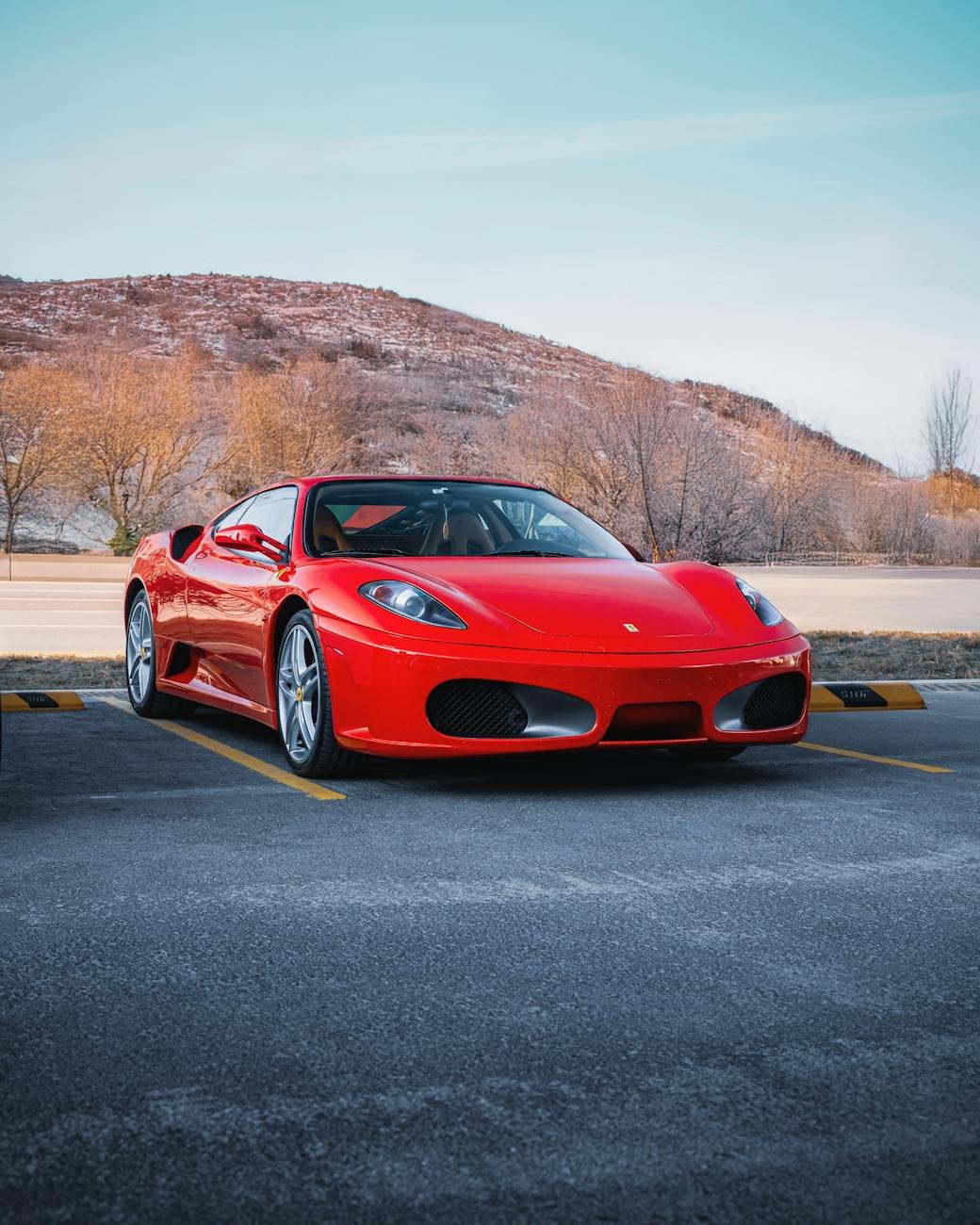 bright red ferrari in ankara parking lot